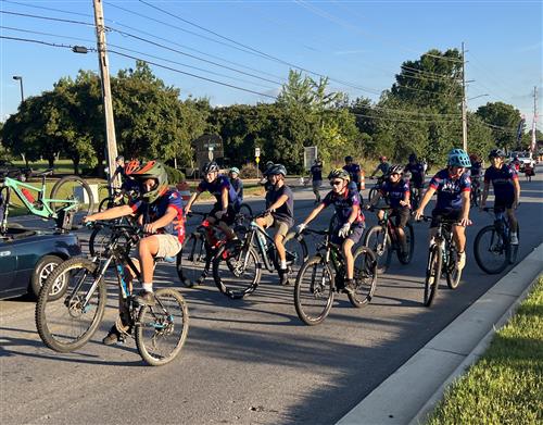 mountain biker club pedaling in parade